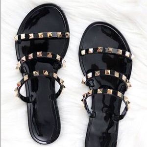 Studded black jelly sandals